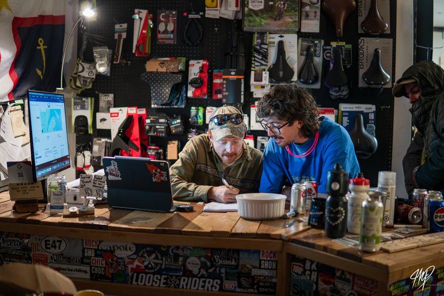 Two people working at a bike shop counter